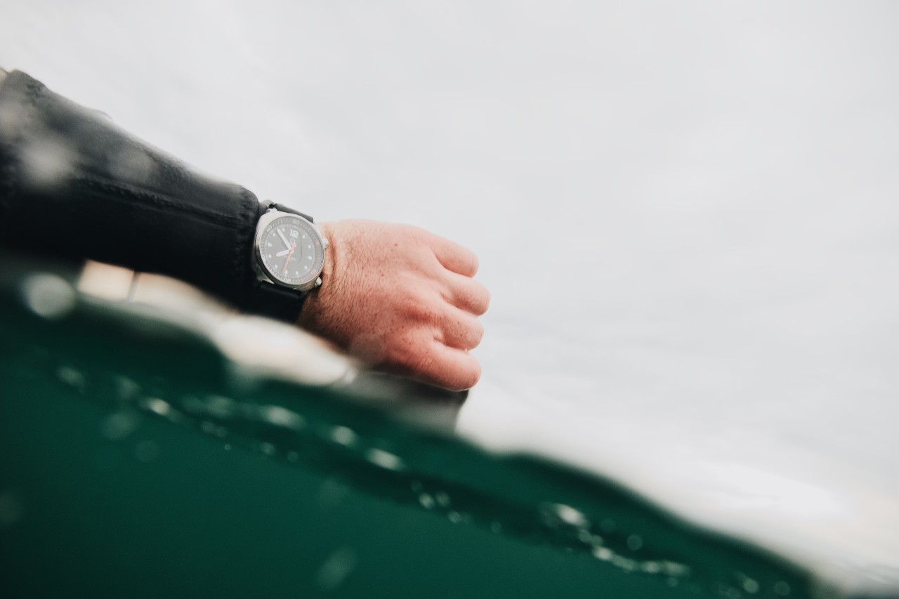 man on boat with watch