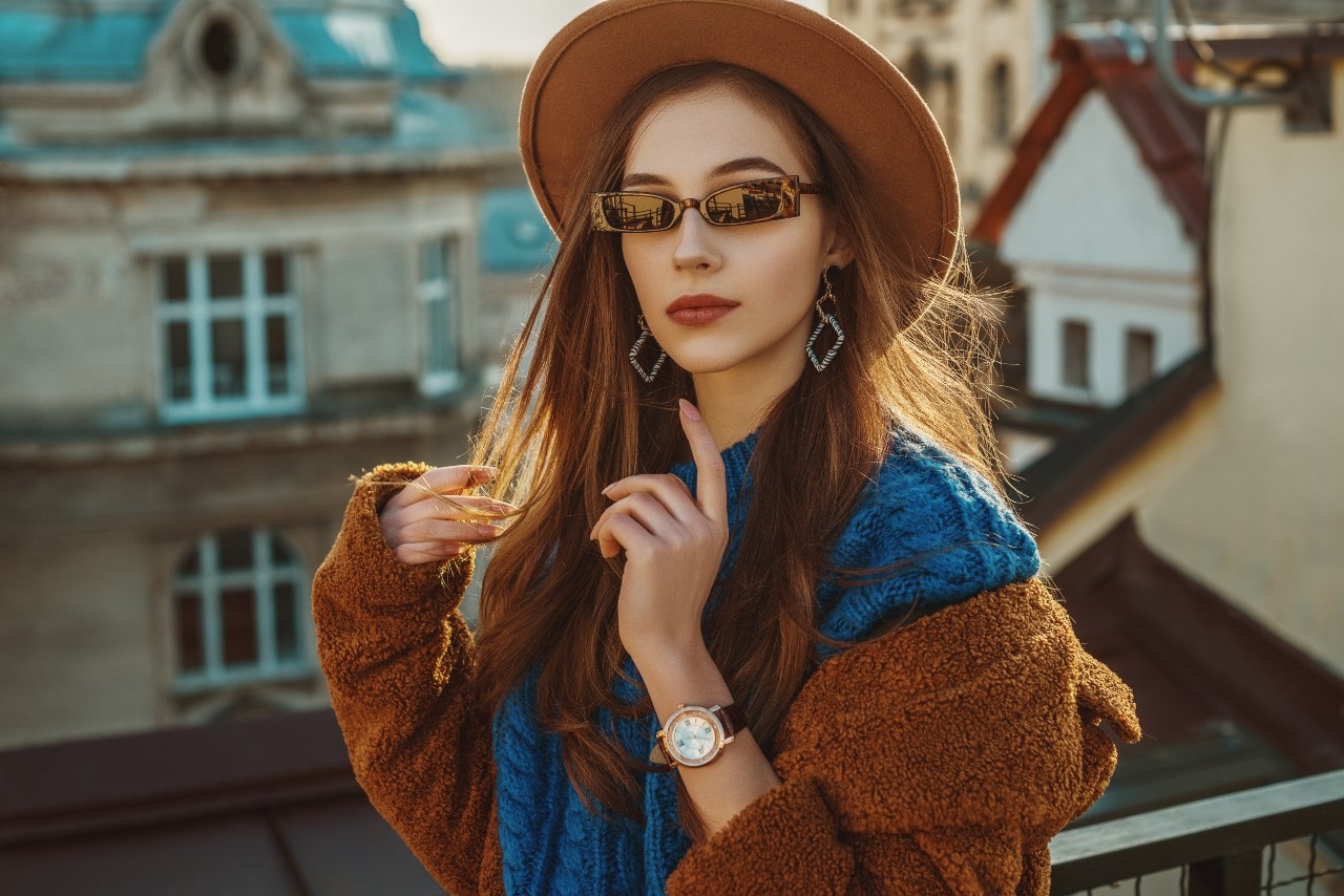 woman with watch on rooftop