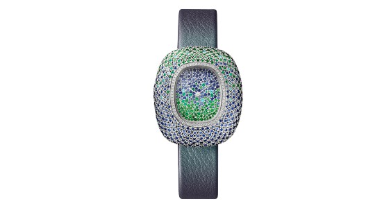 Unique Cartier watch with a plethora of green and blue gemstones on the dial and the bezel