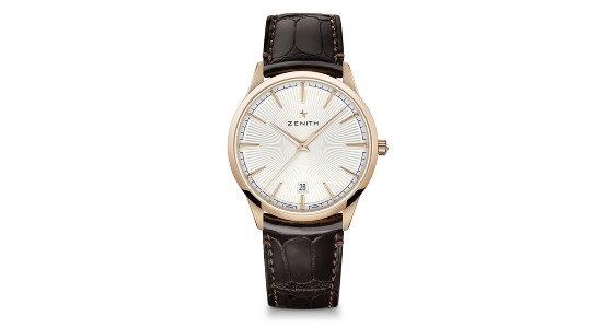 Gold Zenith watch with gold hands and indices, a cream dial, and brown leather strap