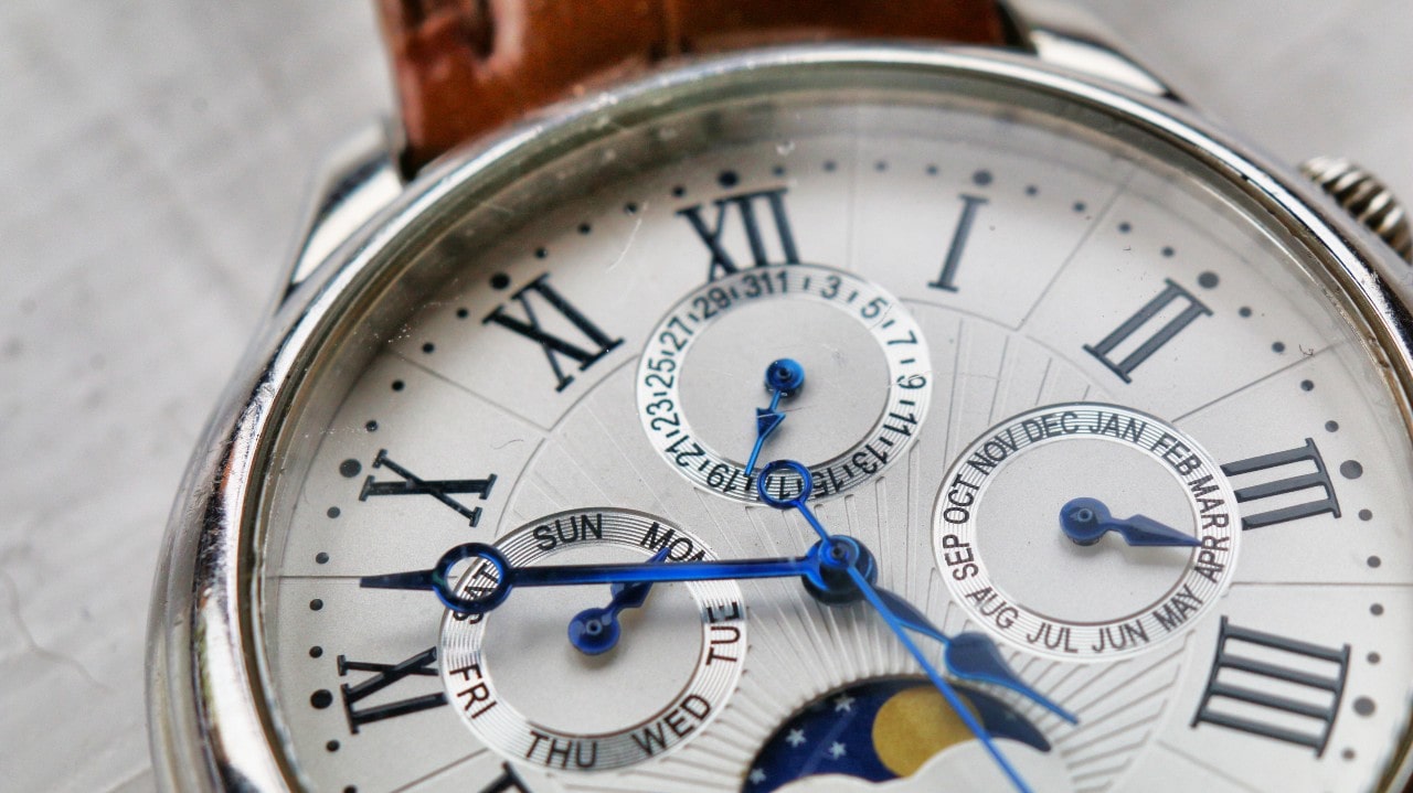 Close-up of a watch’s dial, revealing its complications