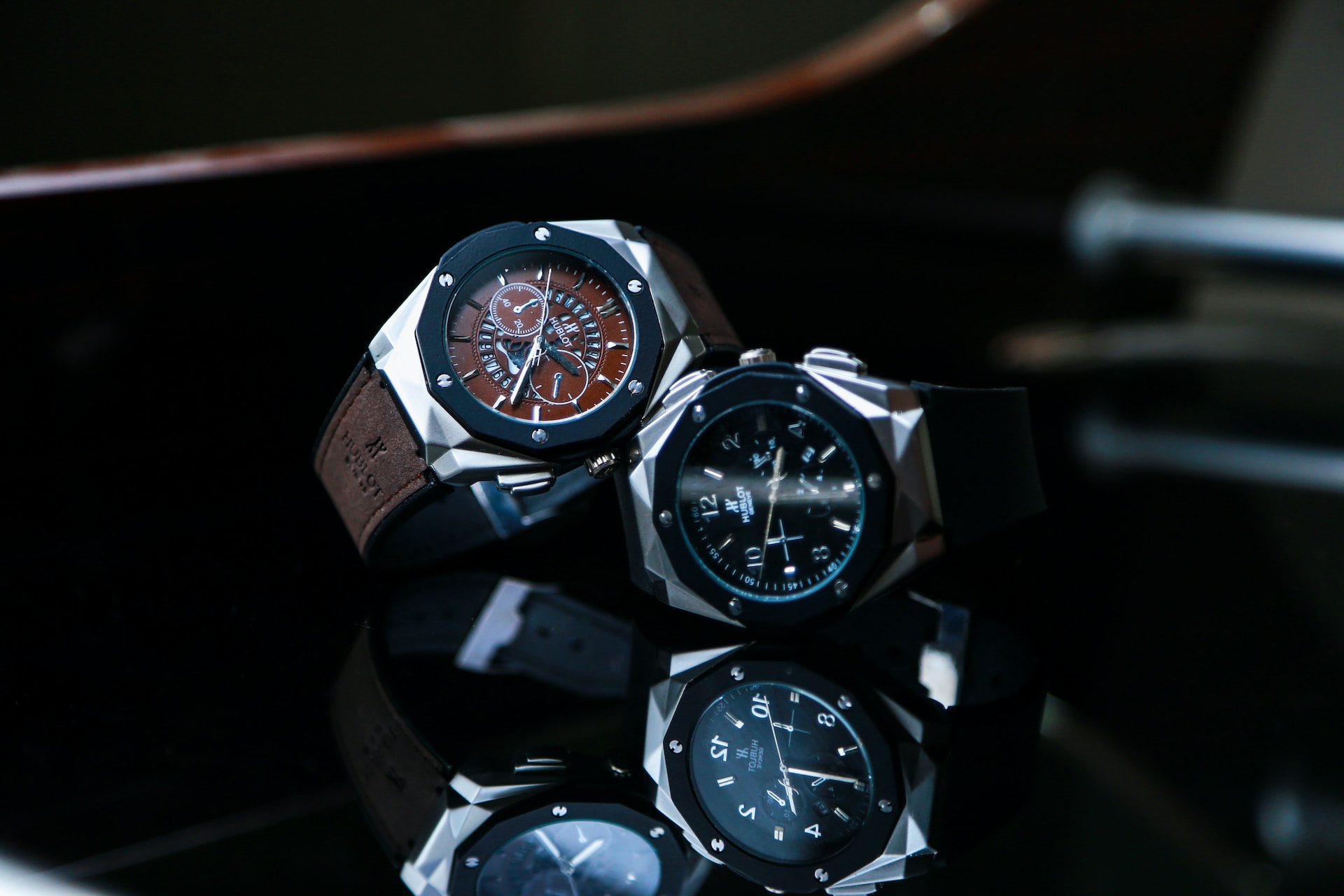 Two sporty watches lay together on a coffee table