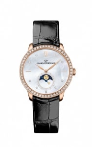 a Girard-Perregaux men’s watch with a moon phase complication and a mother-of-pearl dial.