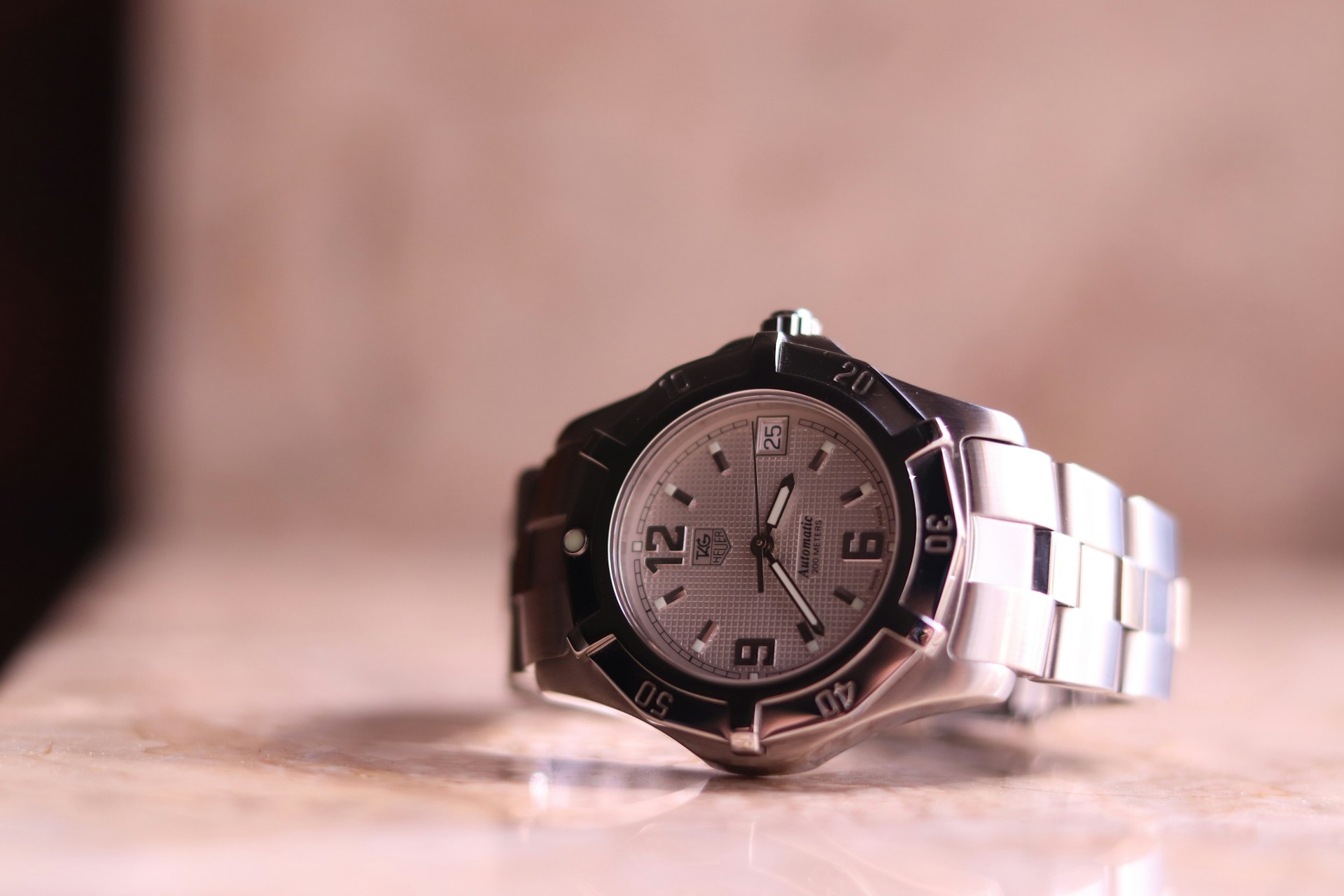 a TAG Heuer watch on a stone background