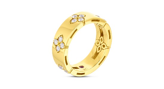 a yellow gold fashion ring with inset diamonds by Roberto Coin