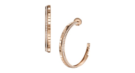 a pair of rose gold hoop earrings with diamond accents