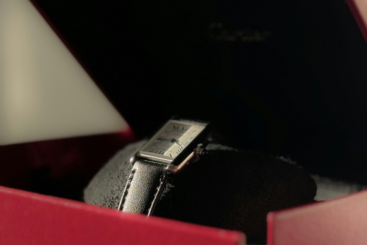 a watch in a red box with case material