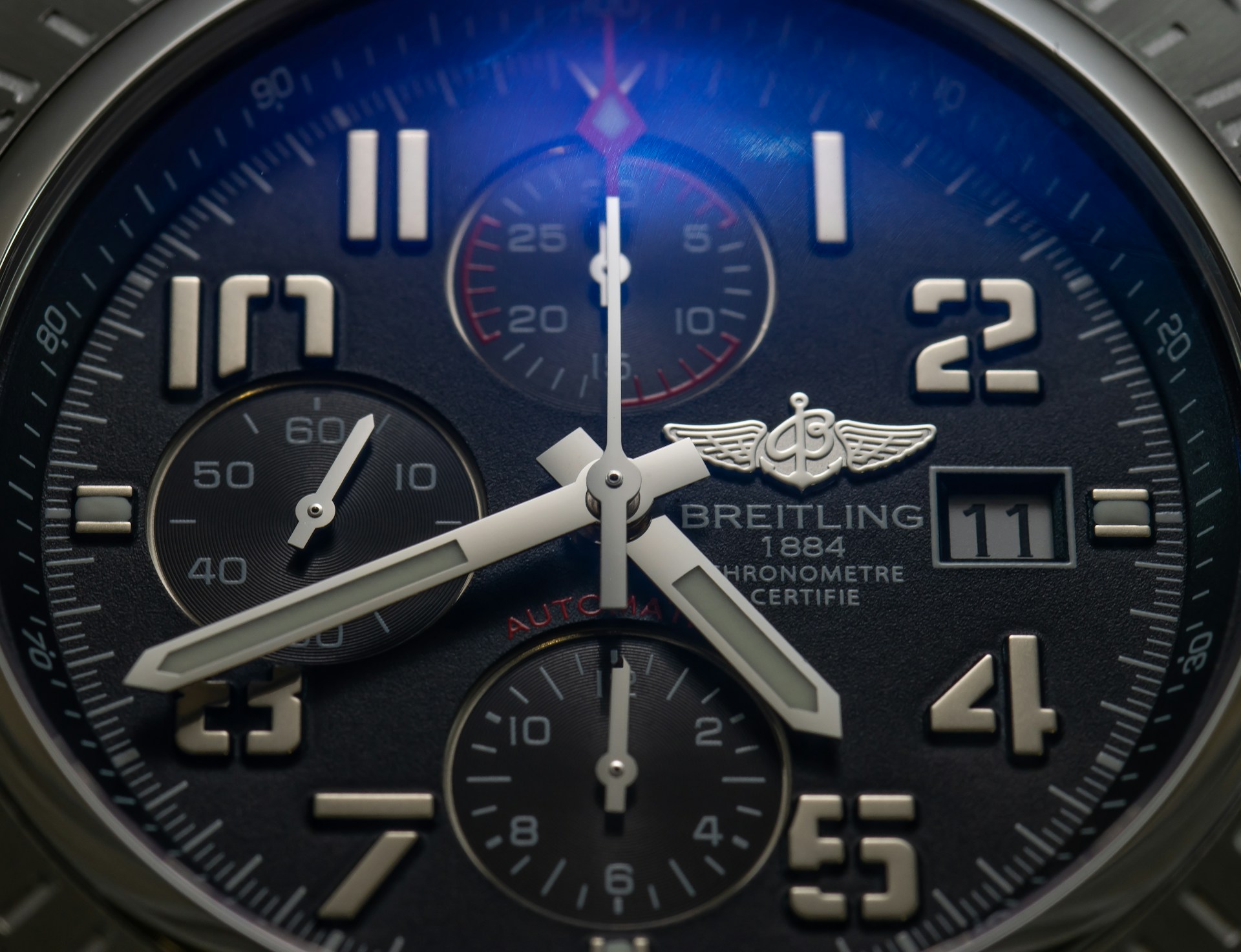 a close-up of a Breitling watch face