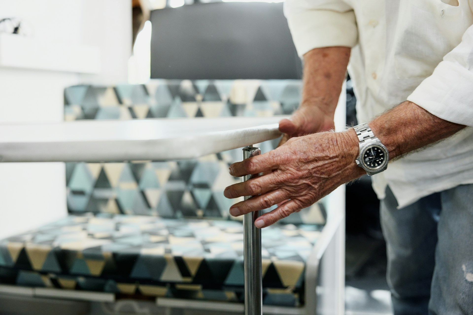 a man wearing a luxury watch working on a table